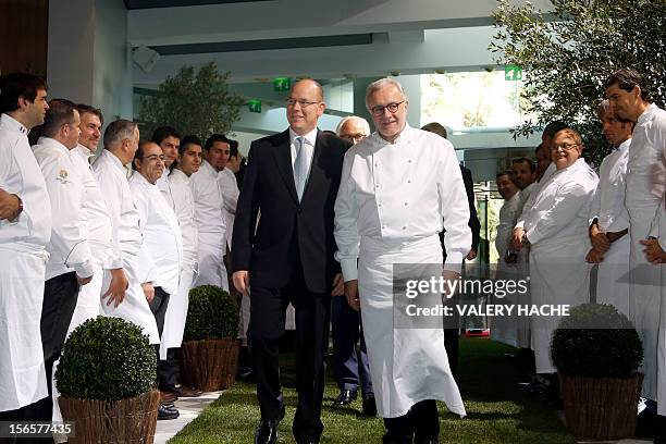 French chef Alain Ducasse and Prince's Albert II of Monaco arrive for the festivities marking the 25th anniversary of Ducasse's restaurant "Le Louis...