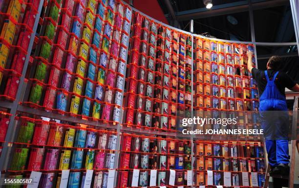 Man sets up a stand before the start of the 62nd Frankfurt Book Fair in Frankfurt am Main, on October 5 where Argentina is this year's guest of...