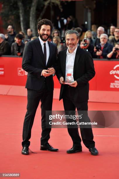 Francesco Scianna and Paolo Sassanelli poses with the L.A.R.A. Award for Best Italian Actor as he attends the Collateral Awards Red Carpet photocall...