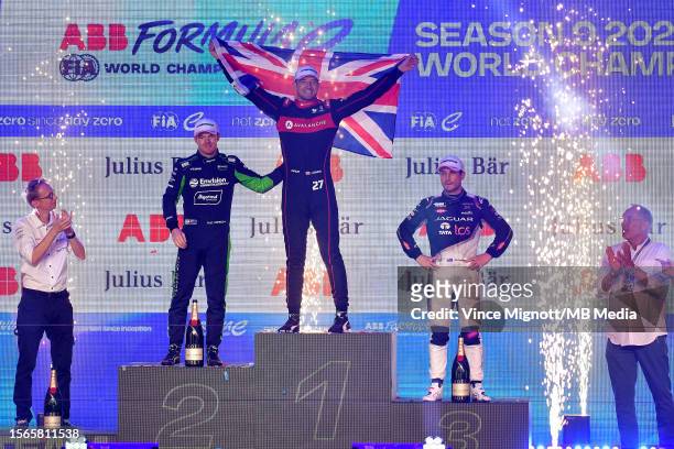 Jake Dennis of Great Britain and AVALANCHE ANDRETTI FORMULA Ecelebrates being crowned FORMULA E world champion on the podium as Nick Cassidy of New...
