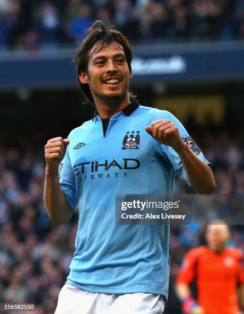 David Silva of Manchester City celebrates scoring the opening goal during the Barclays Premier League match between Manchester City and Aston Villa...