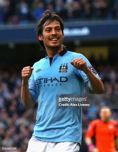 David Silva of Manchester City celebrates scoring the opening goal during the Barclays Premier League match between Manchester City and Aston Villa...