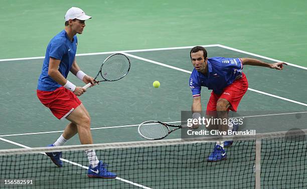 Radek Stepanek and Tomas Berdych of Czech Republic in action during their doubles match against Marc Lopez and Marcel Granollers of Spain during day...