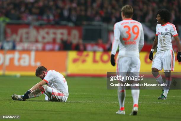 Bastian Schweinsteiger of Muenchen reacts with his team mates Toni Kroos and Dante during the Bundesliga match between 1. FC Nuernberg and FC Bayern...