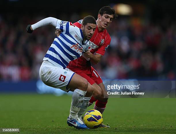Adel Taarabt of QPR holds off Jack Cork of Southampton during the Barclays Premier League match between Queens Park Rangers and Southampton at Loftus...