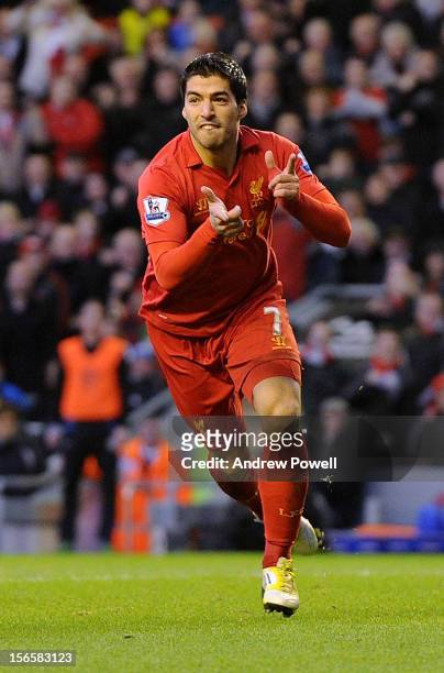 Luis Suarez of Liverpool celebrates his goal making it 1-0 during the Barclays Premier League match between Liverpool and Wigan Athletic at Anfield...