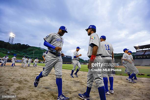 Members of Team Nicaragua warm up in the outfield before Game 2 of the Qualifying Round of the World Baseball Classic against Team Colombia at Rod...