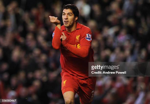 Luis Suarez of Liverpool celebrates his second goal during the Barclays Premier League match between Liverpool and Wigan Athletic at Anfield on...