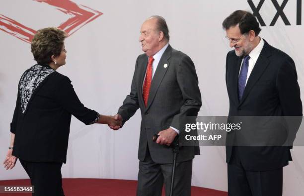 Spain's King Juan Carlos and Spain's Prime Minister Mariano Rajoy welcome Brazil's President Dilma Rousseff during the XXII Ibero-American Summit of...