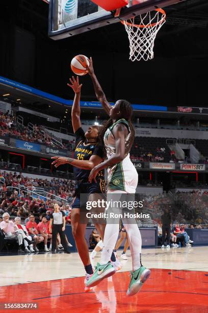 Ezi Magbegor of the Seattle Storm blocks the ball during the game against the Indiana Fever on July 30, 2023 at Gainbridge Fieldhouse in...