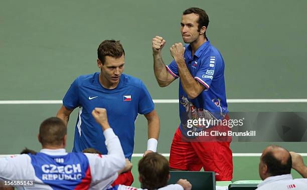 Tomas Berdych and Radek Stepanek of Czech Republic celebrate after match point with their team mates after their four set victory in their doubles...