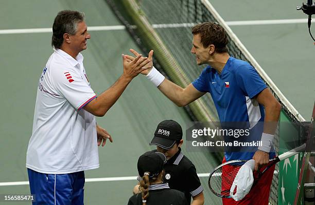 Tomas Berdych of Czech Republic celebrates with his team captain Jaroslav Navratil after their four set victory in their doubles match against Marc...