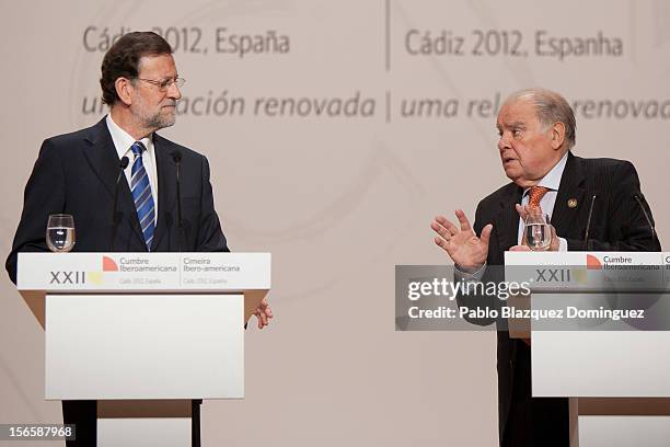 Secretary-General of the Ibero-American Secretariat Enrique Iglesias speaks to President of Spain Mariano Rajoy during a press conference at the end...