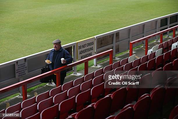 An AFC Wimbledon fan finds a position to watch the npower League Two match between AFC Wimbledon and Aldershot Town at the Cherry Red Records Stadium...