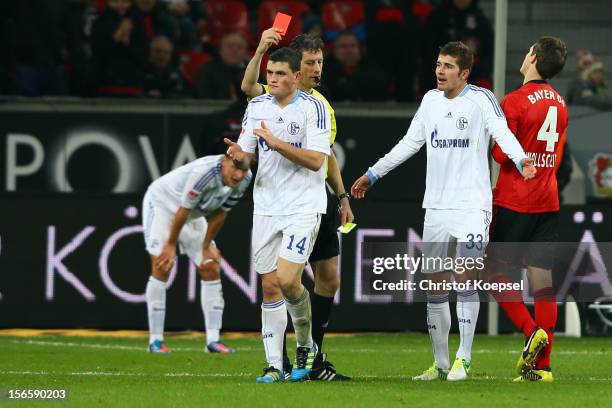 Referee Wolfgang Stark shows Kyriakos Papadopoulos of Schalke the red card during the Bundesliga match between Bayer 04 Leverkusen and FC Schalke 04...