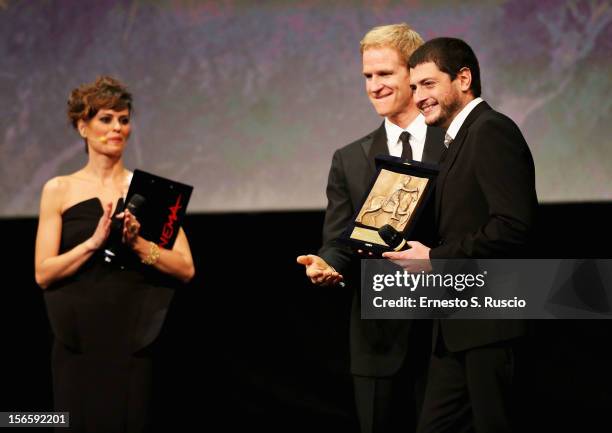 Director Claudio Giovannesi with his award for Best Debut and Second Film for 'Ali Ha Gli Occhi Azzurri' with Jury President Matthew Modine on stage...