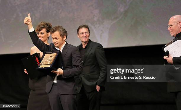 Director Paolo Franchi poses on stage with Best Director Award for the movie 'E la chiamano estate' during the Awards Ceremony at the 7th Rome Film...