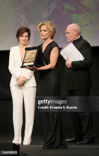 Actress Isabella Ferrari poses on stage with Best Actress Award for the movie 'E la chiamano estate' during the Awards Ceremony at the 7th Rome Film...