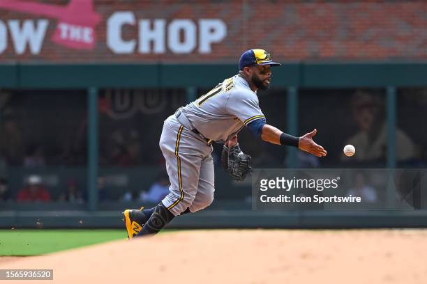 Milwaukee Brewers first baseman Carlos Santana makes a play during the MLB game between the Milwaukee Brewers and Atlanta Braves on July 30 at Truist...