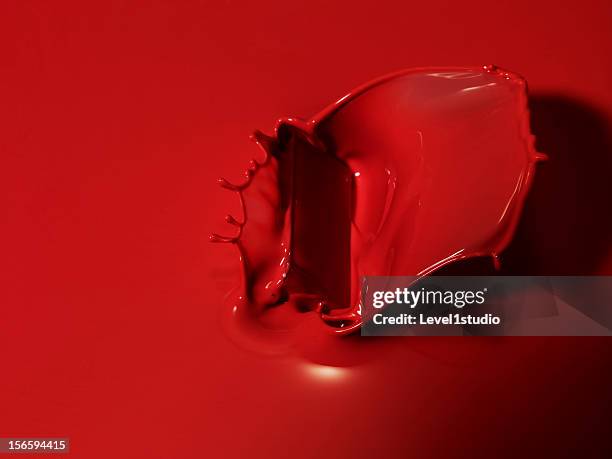 red liquid splashing - red paint splash stock pictures, royalty-free photos & images