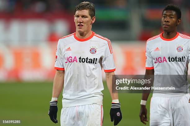 Bastian Schweinsteiger of Muenchen reacts with his team mate David Alaba after the Bundesliga match between 1. FC Nuernberg and FC Bayern Muenchen at...