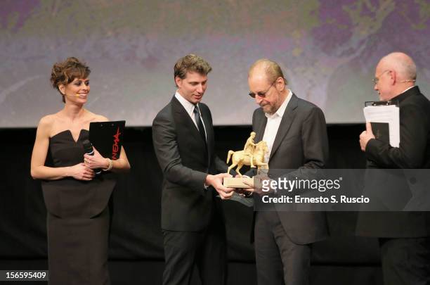 Director Larry Clark receives the Golden Marc ’Aurelio for Best Film 'Marfa Girl' from Jury President Jeff Nichols during the Awards Ceremony at the...