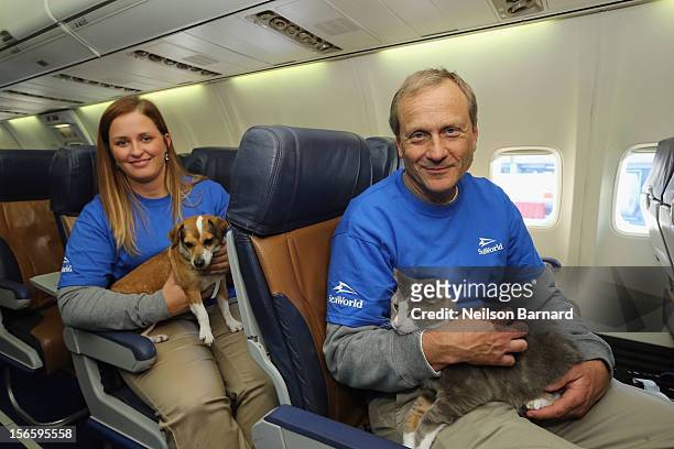 SeaWorld Rescue team members Jessica Decoursey and Dr. David Brinker pose with rescue dogs onboard the Southwest Airlines flight. Sixty orphaned dogs...