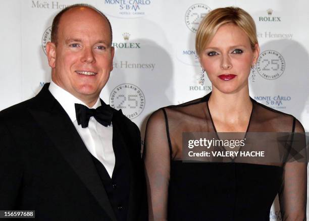 Prince Albert II of Monaco and Princess Charlene pose during the festivities marking the 25th anniversary of Ducasse's restaurant "Le Louis XV", on...