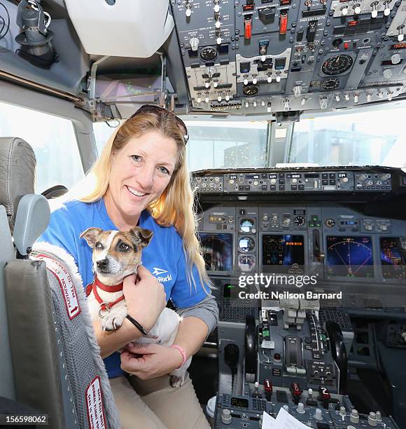 SeaWorld Rescue team member Anita Yeattes poses with a rescue dog. Sixty orphaned dogs and cats who are being flown across the country from Newark...