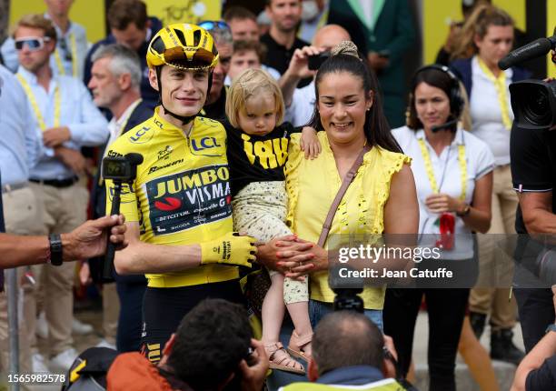 Tour de France 2023 winner, yellow jersey Jonas Vingegaard of Denmark and Jumbo - Visma celebrates with Trine Hansen and their daughter Frida...