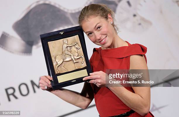 Actress Marilyne Fontaine poses with her Best Emerging Actress Award during the Award Winners Photocall during the 7th Rome Film Festival at...