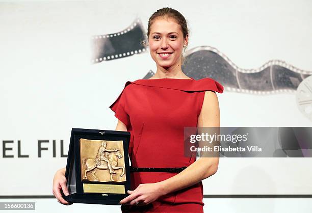 Actress Marilyne Fontaine poses with her Best Emerging Actress Award during the Award Winners Photocall during the 7th Rome Film Festival at...