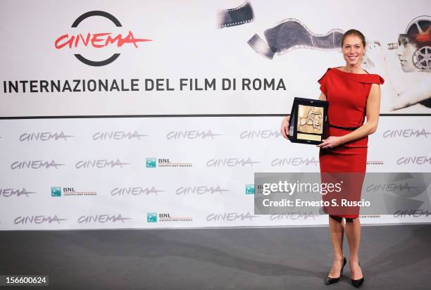 Actress Marilyne Fontaine poses with her Best Emerging Actress Award during the Award Winners Photocall during the 7th Rome Film Festival at...