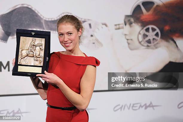 Actress Marilyne Fontaine poses with her Best Emerging Actress Award during the Award Winners Photocall during the 7th Rome Film Festival at...