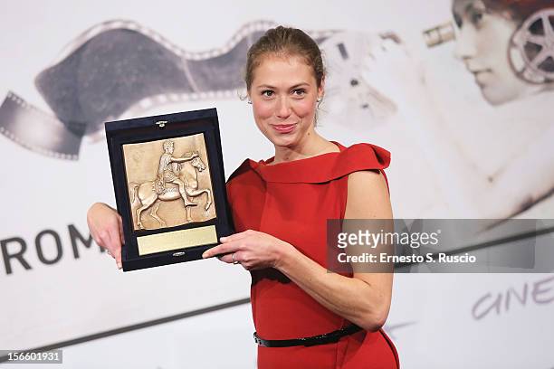 Actress Marilyne Fontaine poses with her Best Emerging Actress Award during the Award Winners Photocall during the 7th Rome Film Festival at...