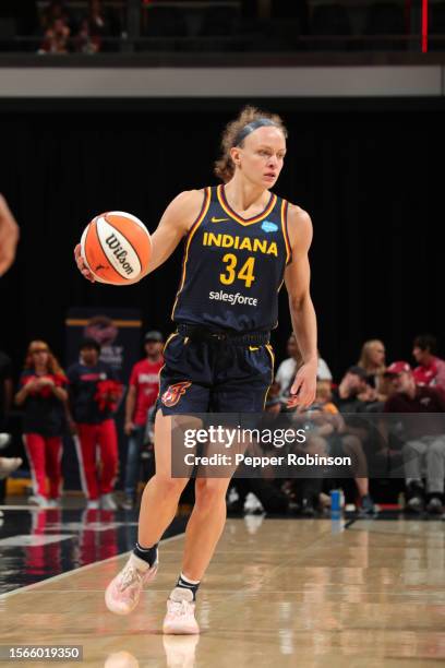 Grace Berger of the Indiana Fever dribbles the ball during the game against the Seattle Storm on July 30, 2023 at Gainbridge Fieldhouse in...