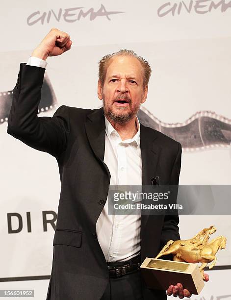 Director Larry Clark poses with his Golden Marc'Aurelio for Best Film druing the Award Winners Photocall during the 7th Rome Film Festival at...