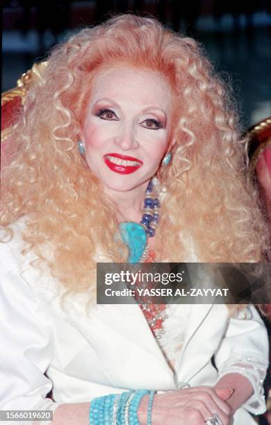 Lebanese popular singer and actress Sabah poses 29 May 2002 upon her arrival in Kuwait. Sabah will be the guest of honour of an international fashion...