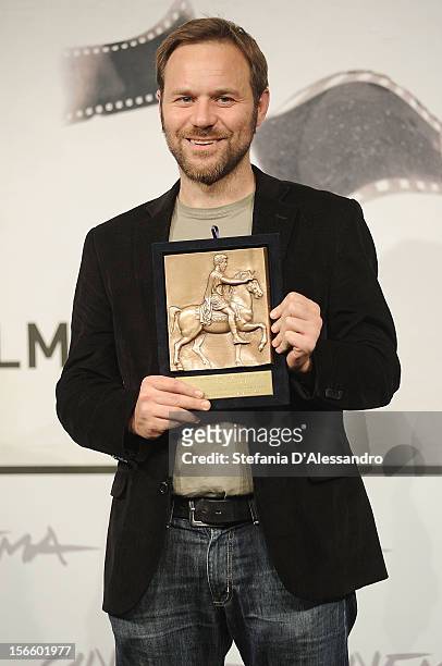 Director Antonello Schioppa poses with his Prospettive Award for Best Short Film during the Award Winners Photocall on November 17, 2012 in Rome,...