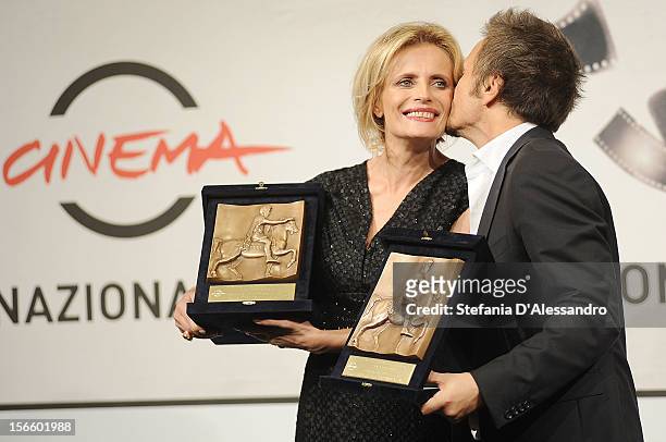 Actress Isabella Ferrari and director Paolo Franchi pose with her Best Actress Award and his Best Director Award during the Award Winners Photocall...