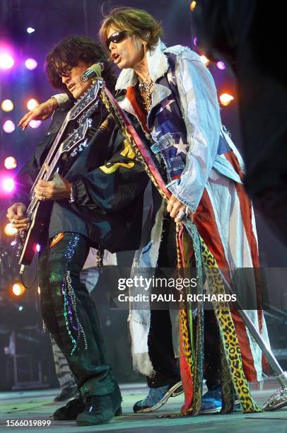 Aerosmith lead guitar player Joe Perry and lead singer Steven Tyler perform in the United We Stand concert 21 October 2001 at RFK Stadium in...