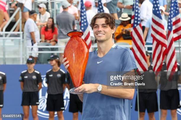 Taylor Fritz poses for a photo with the trophy after defeating Aleksandar Vukic of Australia in the ATP Atlanta Open final at Atlantic Station on...