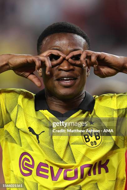 Youssoufa Moukoko of Borussia Dortmund celebrates after scoring a goal to make it 2-3 during the pre-season friendly match between Manchester United...