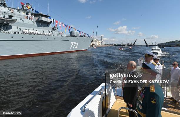 This pool image distributed by Sputnik agency shows Russian President Vladimir Putin, accompanied by Defence Minister Sergei Shoigu and...