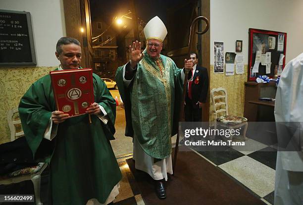 Cardinal Timothy Dolan , Archbishop of New York, enters to lead anniversary Mass at Immaculate Conception parish on November 17, 2012 in the Staten...