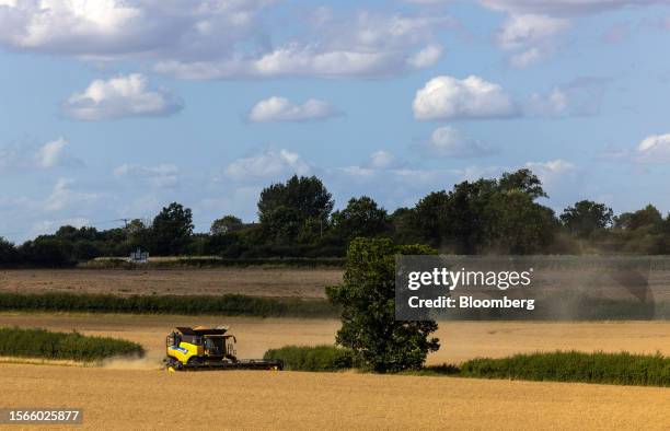 Combine harvester operates in a field during a wheat harvest on a farm near Chipping Ongar, UK, on Saturday, July 29, 2023. Wheat traded in Chicago...