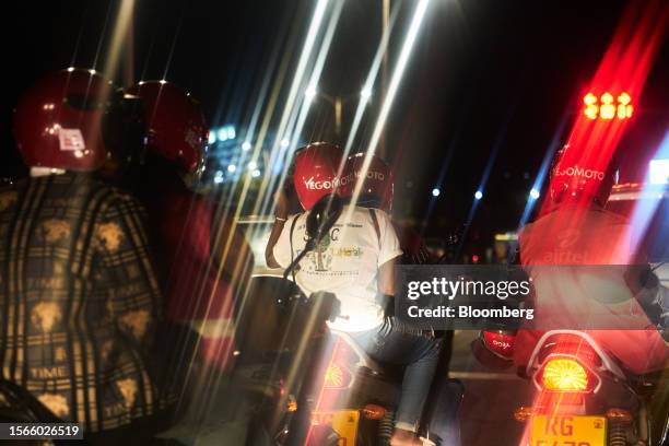 Yegomoto ride-hailing moto taxis wait at a stoplight in the Gasabo district of Kigali, Rwanda, on Friday, July 21, 2023. The World Bank cut Rwanda's...