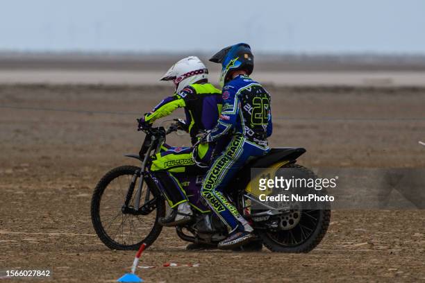 Paul Cooper gives his fellow competitor Arran Butcher a ride around the track on his lap of honour, after winning the Fylde ACU British Sand Racing...