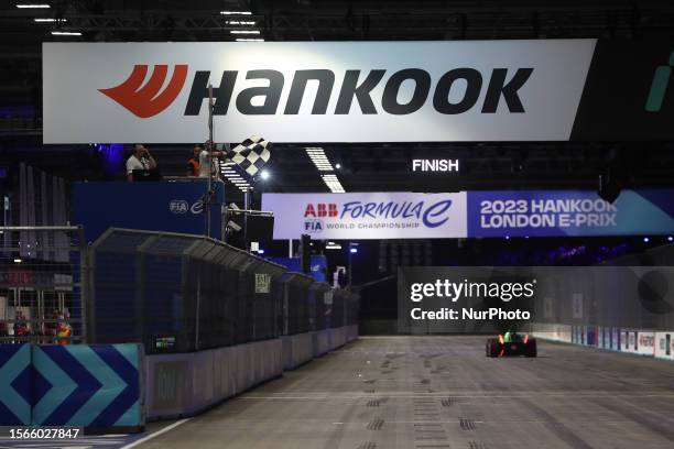 Nick Cassidy of New Zealand driving for the ENVISION RACING team receives the chequered flag after winning the Hankook London E-Prix, Round 16 of the...