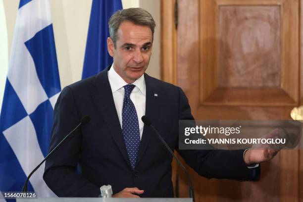 Greece's Prime Minister Kyriakos Mitsotakis speaks during a press conference with Cyprus' President following their meeting at the Presidential...